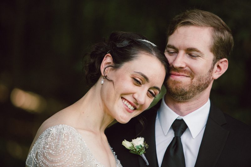 Newlywed Bliss art-deco-wedding-bride-leaning-her-head-against-grooms-cheek- both-smiling