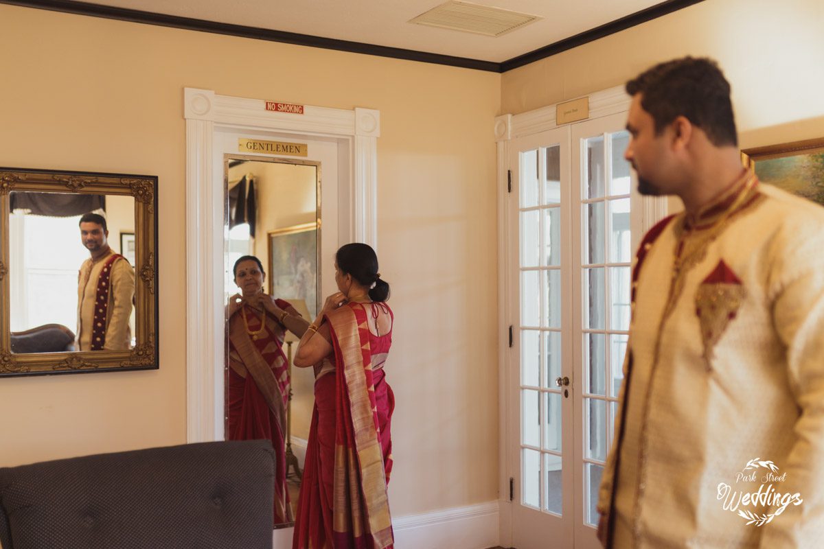 Wedding Day Ready mom-looking-in-mirror-with-groom-looking-on-for_indian-wedding