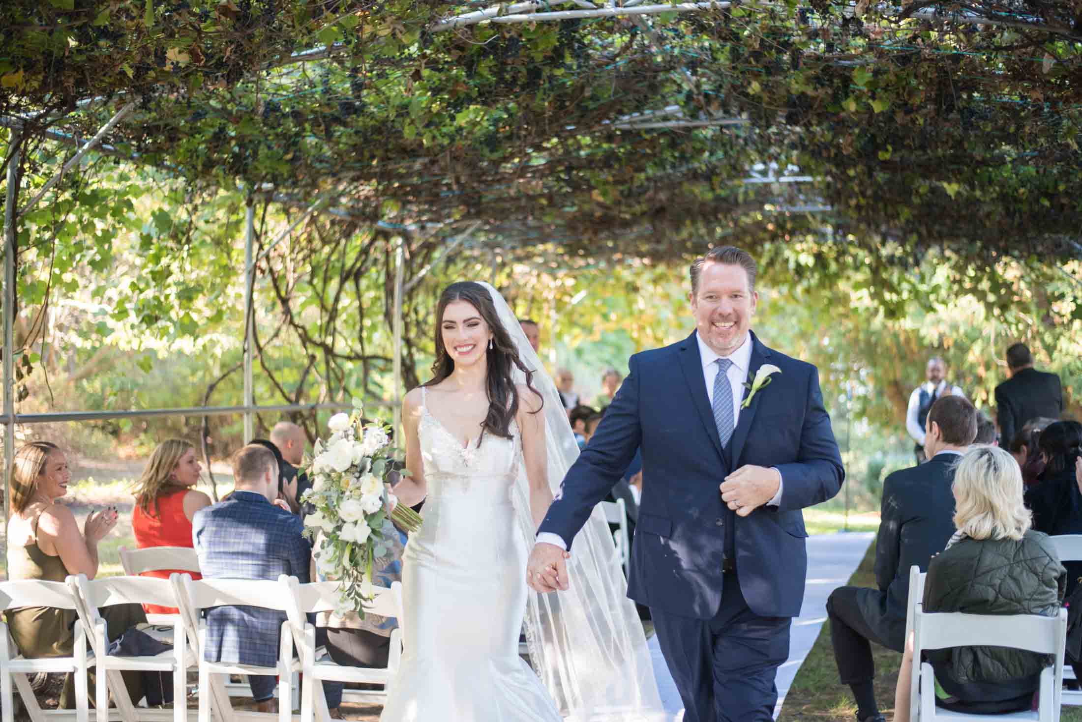 Vineyard Style Ceremony vineyard-style-ceremony-over-bride-groom-walking-down-aisle